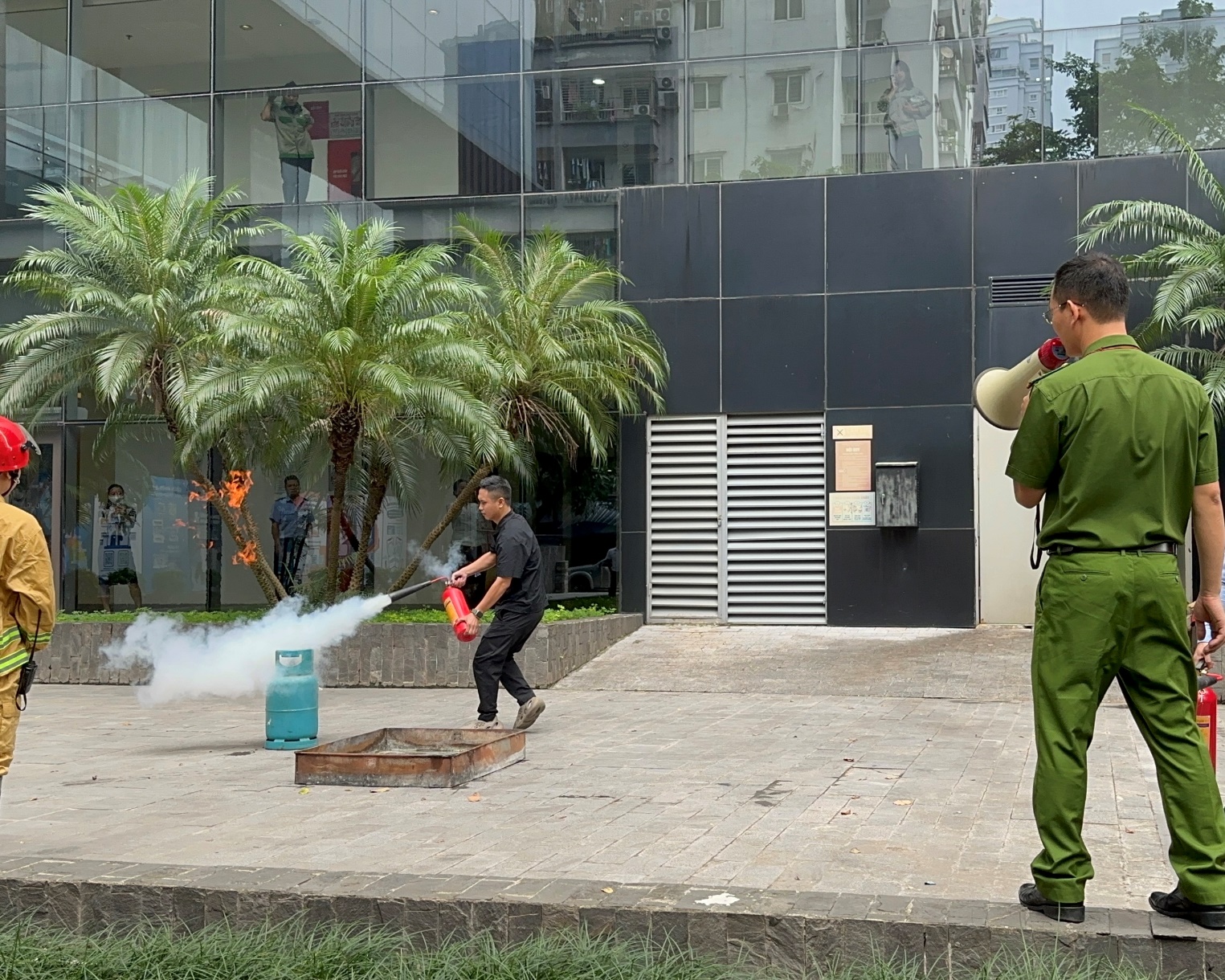 A person using a megaphone to extinguish a fire

Description automatically generated