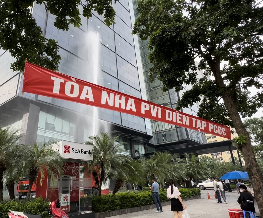 A red banner with white text above a building

Description automatically generated